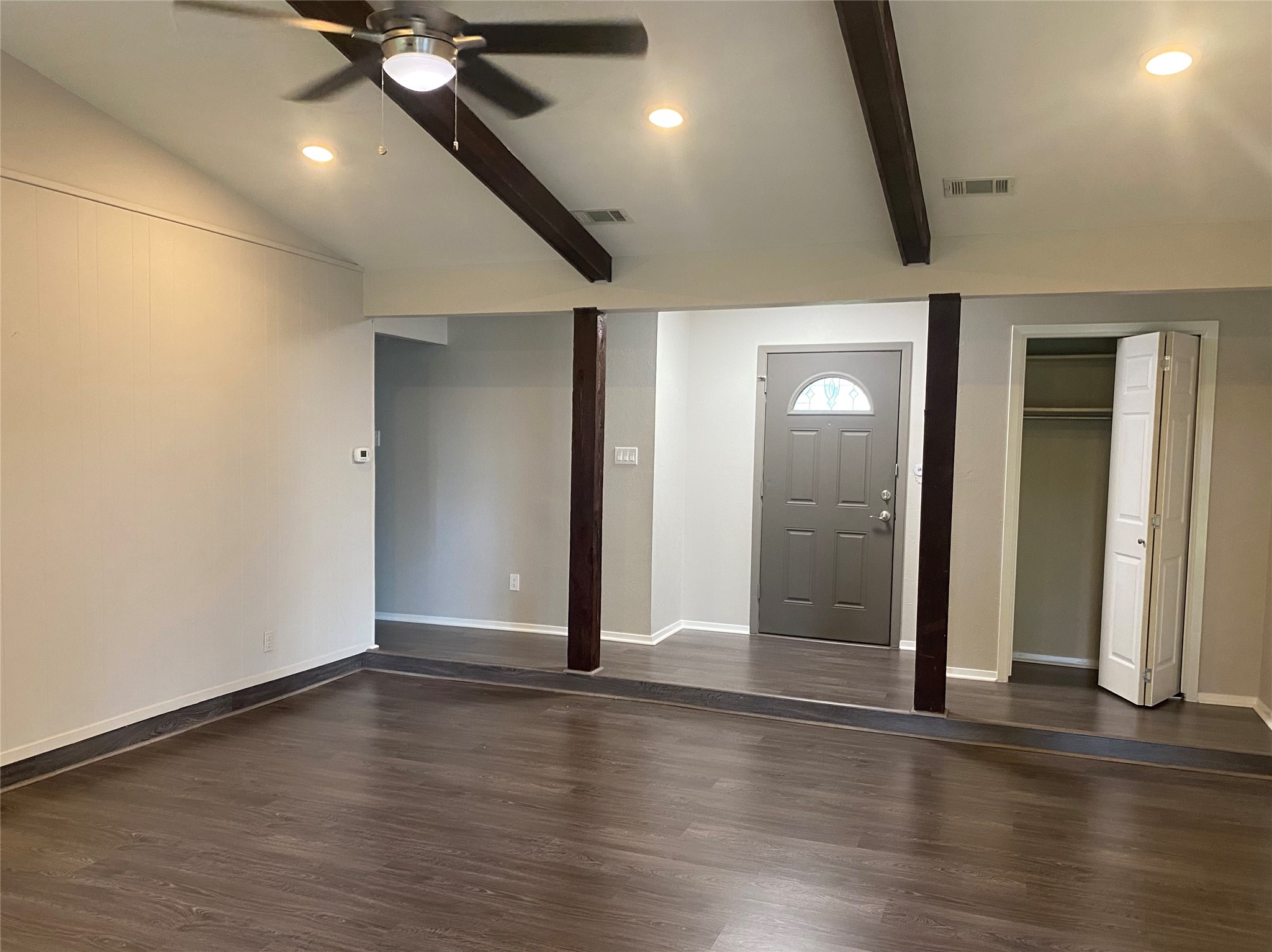 11505 Windermere Meadows Austin, TX 78759 - Photo 4 of 16 an empty room with wooden floor and windows
