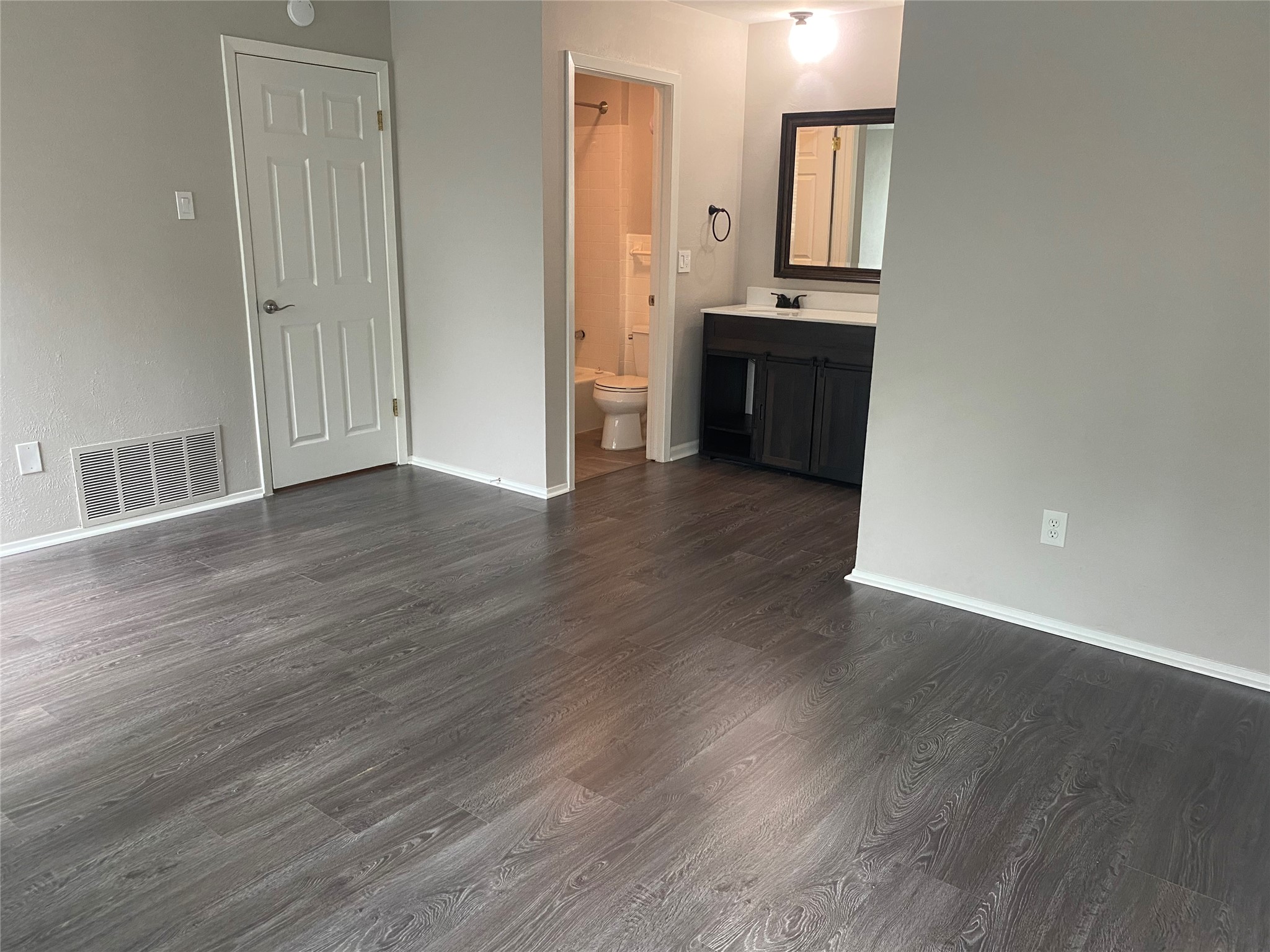 11505 Windermere Meadows Austin, TX 78759 - Photo 7 of 16 an empty room with wooden floor and entrance