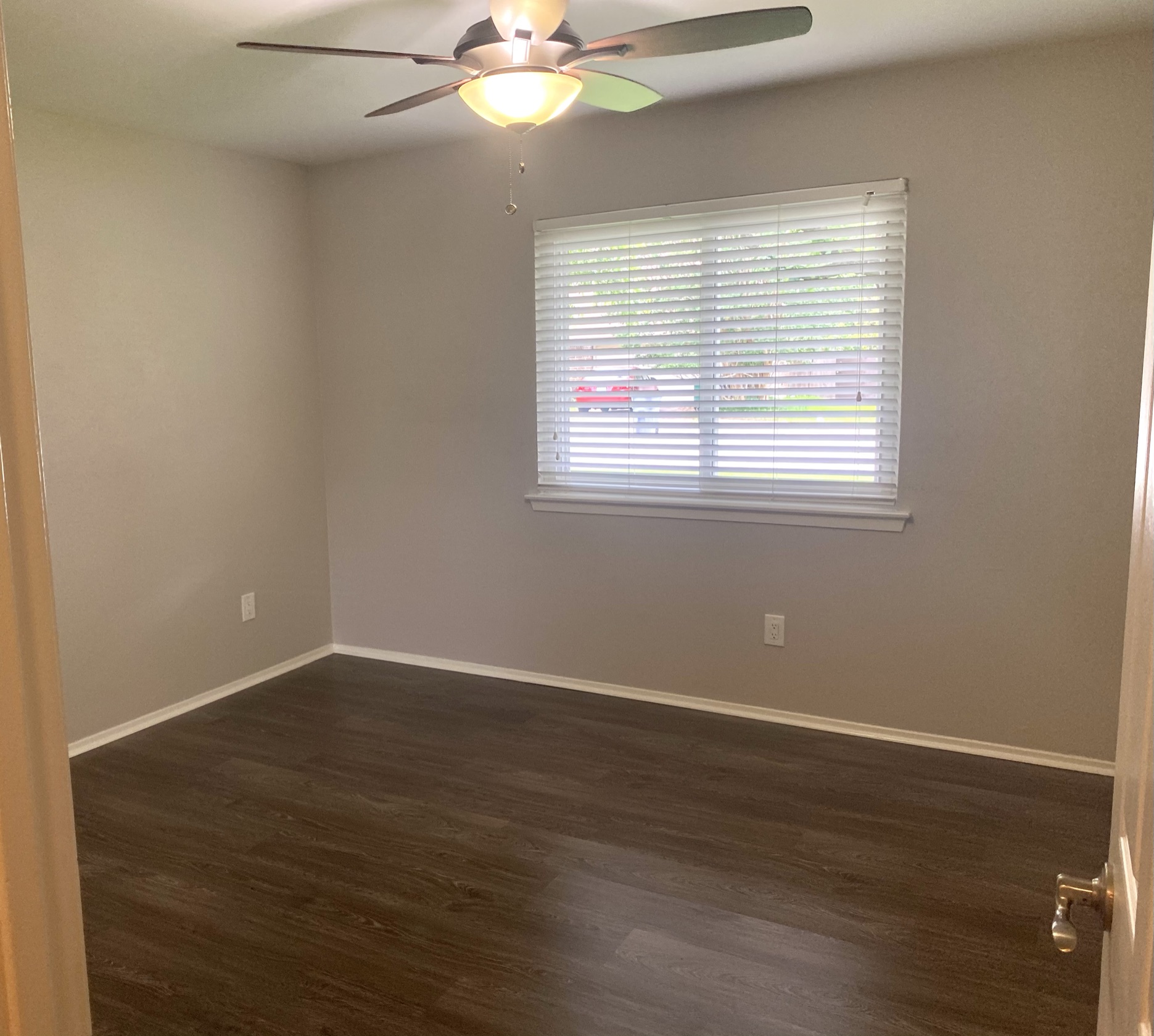 11505 Windermere Meadows Austin, TX 78759 - Photo 8 of 16 an empty room with wooden floor and windows