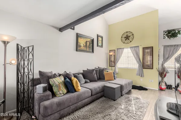 a living room with furniture and a large window