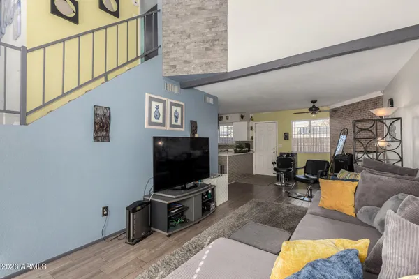 a living room with furniture and a flat screen tv
