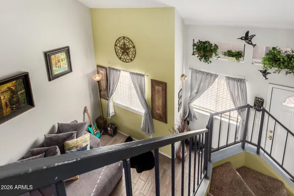 a view of a entryway with furniture and wooden floor