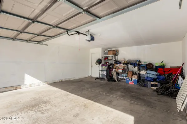 a view of a garage with rack and bicycle