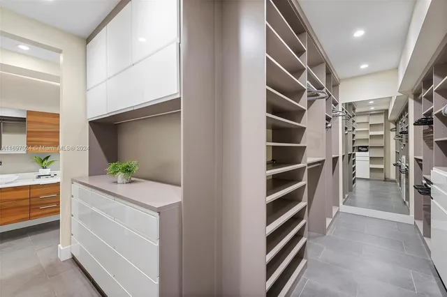 a bedroom with a bed and a view of living room