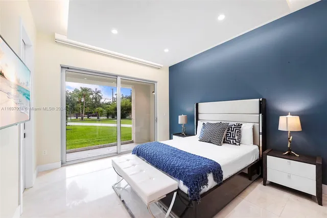 a bedroom with two beds and a chandelier