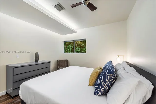 a view of a patio with a table and chairs