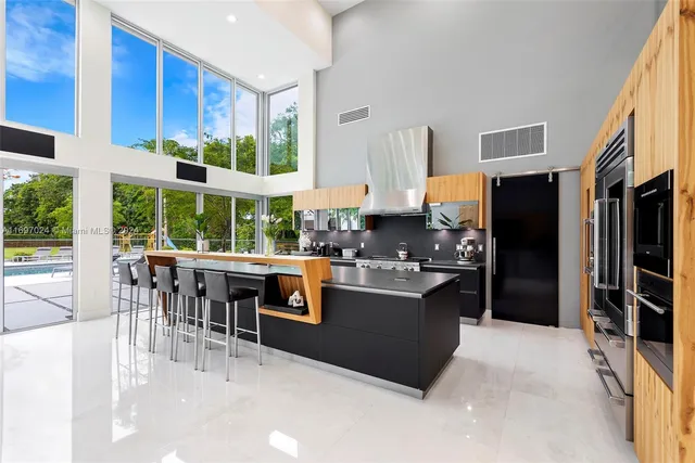 a kitchen with stainless steel appliances granite countertop a stove and a refrigerator