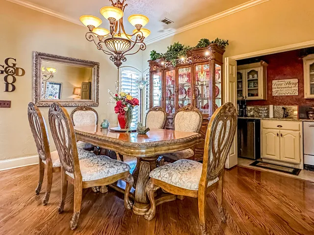 a bedroom with furniture and a chandelier
