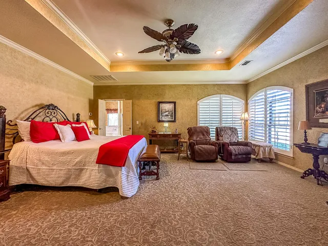 a view of a patio with table and chairs with wooden floor and fence