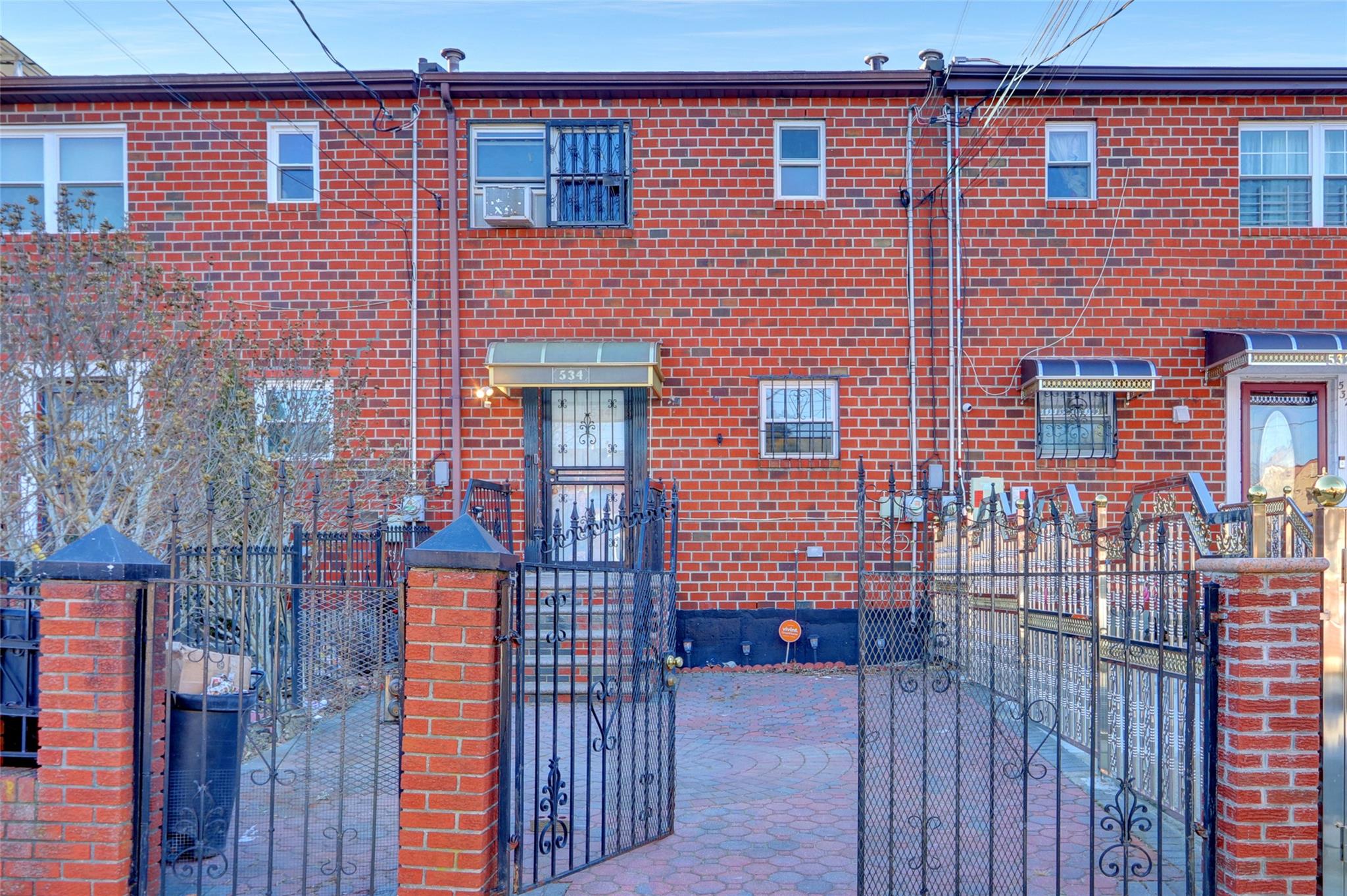 534 Warwick Street Brooklyn, NY 11207 - Photo 1 of 1 a front view of a house with glass windows