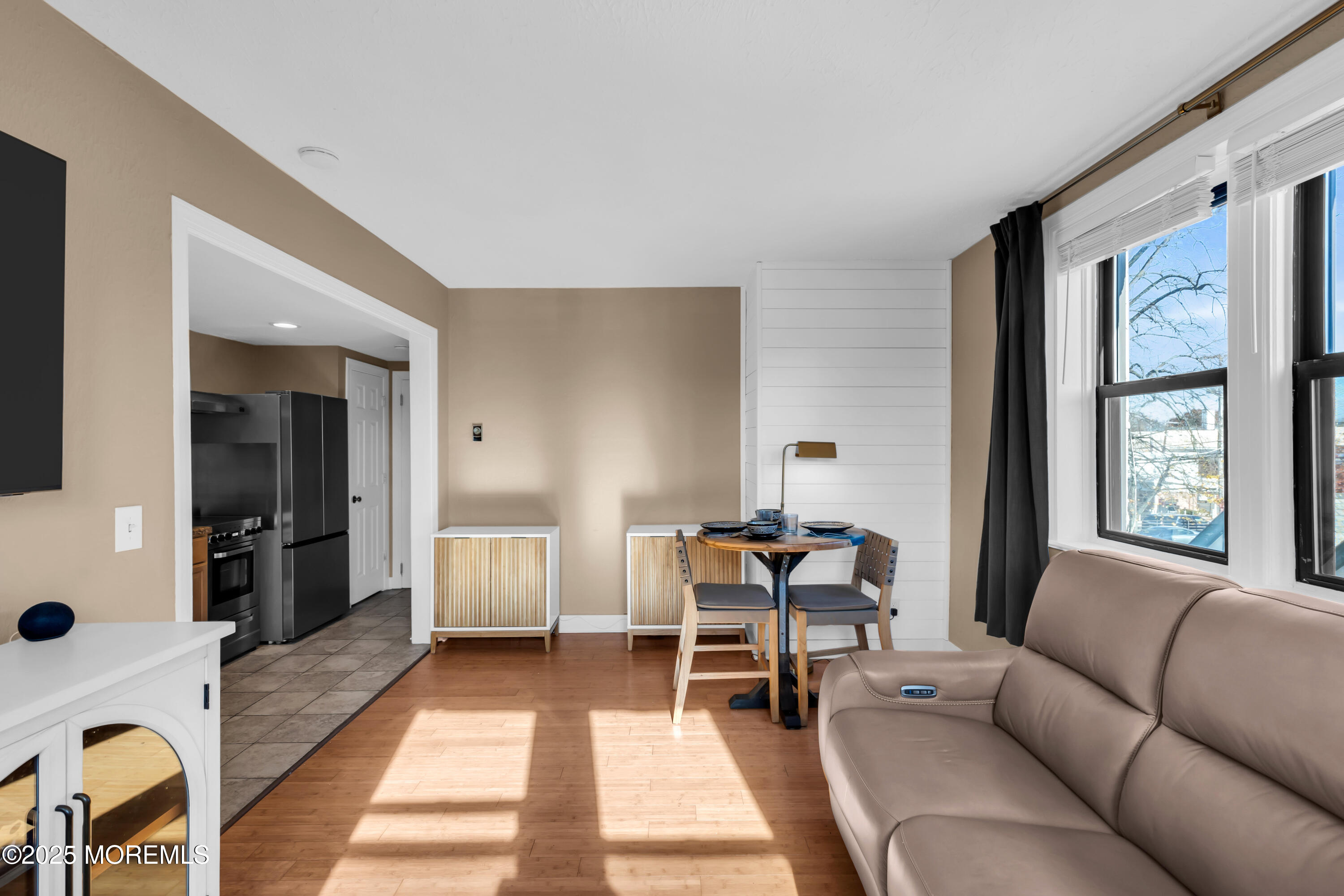17 Leroy Place, Unit 2B Red Bank, NJ 07701 - Photo 13 of 24 a living room with furniture and a large window
