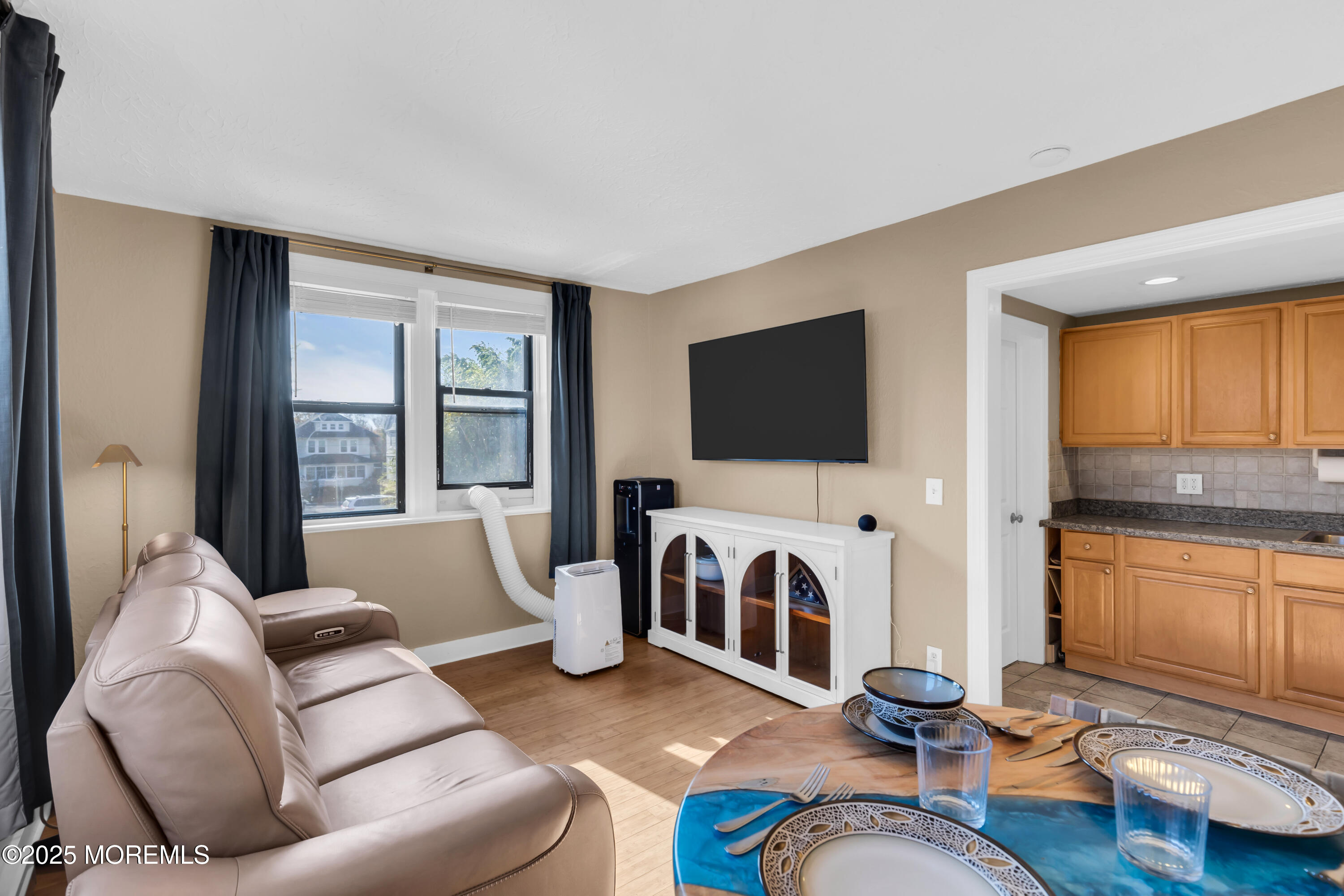17 Leroy Place, Unit 2B Red Bank, NJ 07701 - Photo 15 of 24 a living room with furniture and a flat screen tv