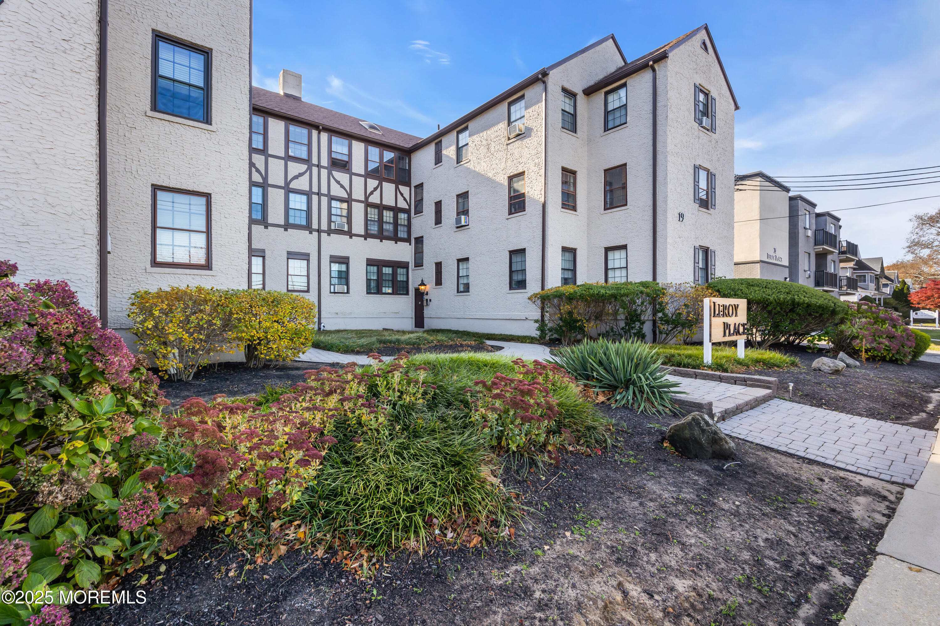 17 Leroy Place, Unit 2B Red Bank, NJ 07701 - Photo 21 of 24 a front view of a building with garden