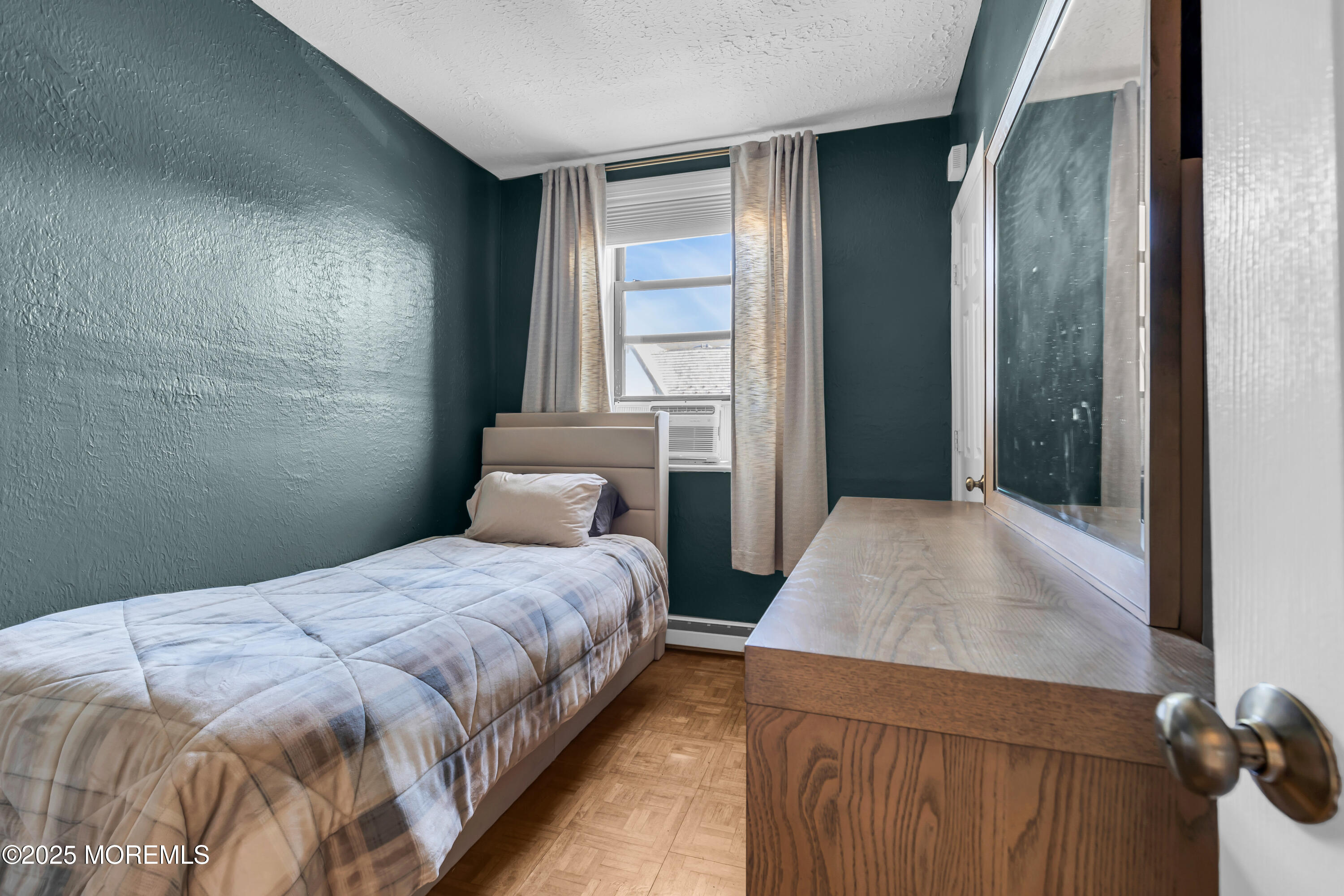 17 Leroy Place, Unit 2B Red Bank, NJ 07701 - Photo 4 of 24 a bedroom with a bed and a window