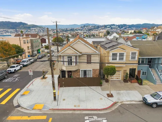 an aerial view of a house with a swimming pool