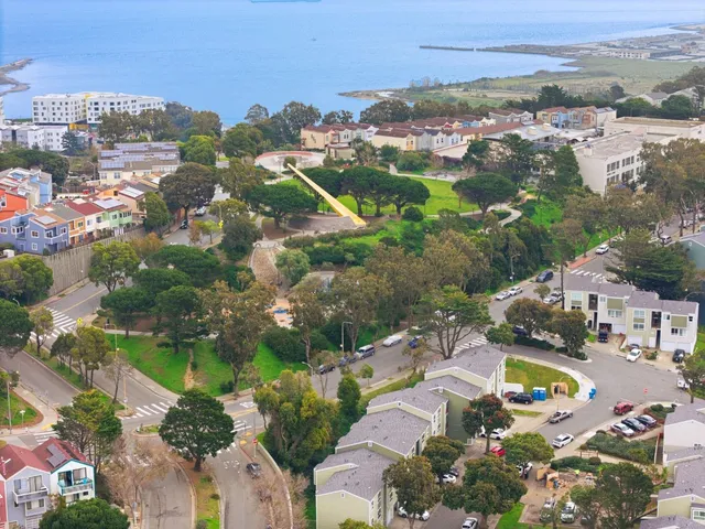 an aerial view of residential houses with outdoor space