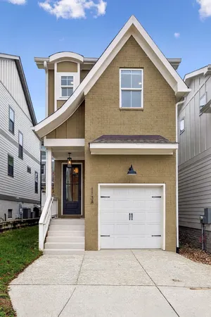 a front view of a house with a garage