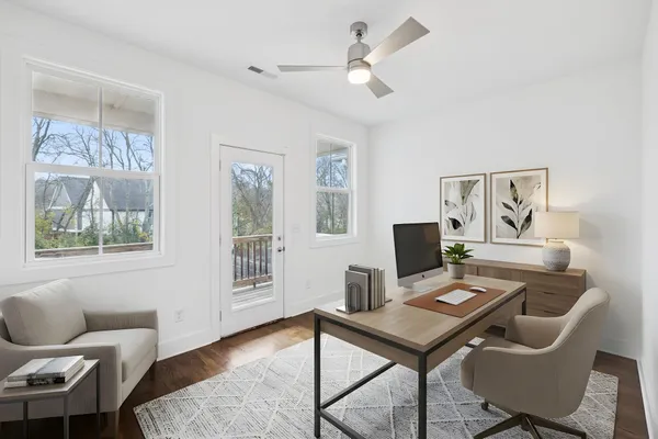 a workspace with furniture and a window
