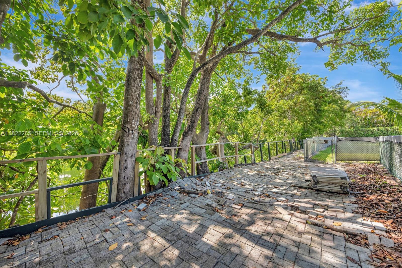 11230 Southwest 69th Court Pinecrest, FL 33156 - Photo 74 of 87 To Canal in backyard