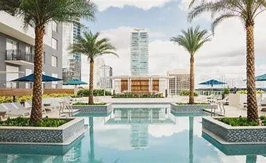 a view of a swimming pool and outdoor seating