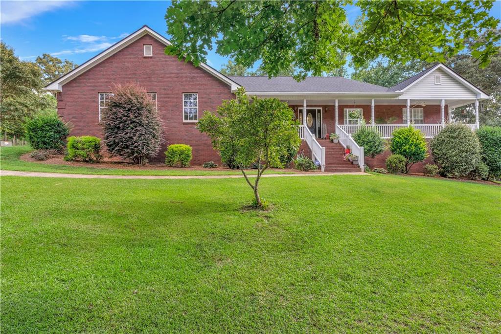 a front view of a house with a yard