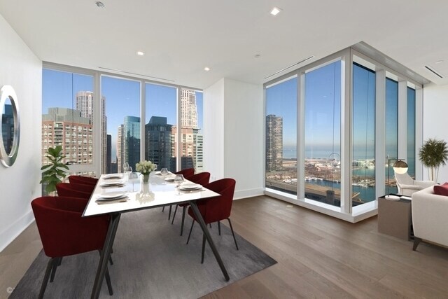Undisclosed Address Chicago, IL 60601 - Photo 3 of 21 a view of a dining room with furniture window and wooden floor