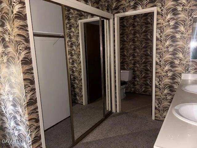 a view of bathroom with a shower and toilet
