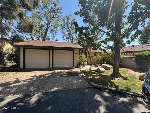 a front view of a house with sitting area
