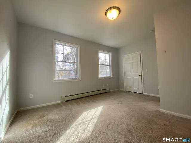 an empty room with windows