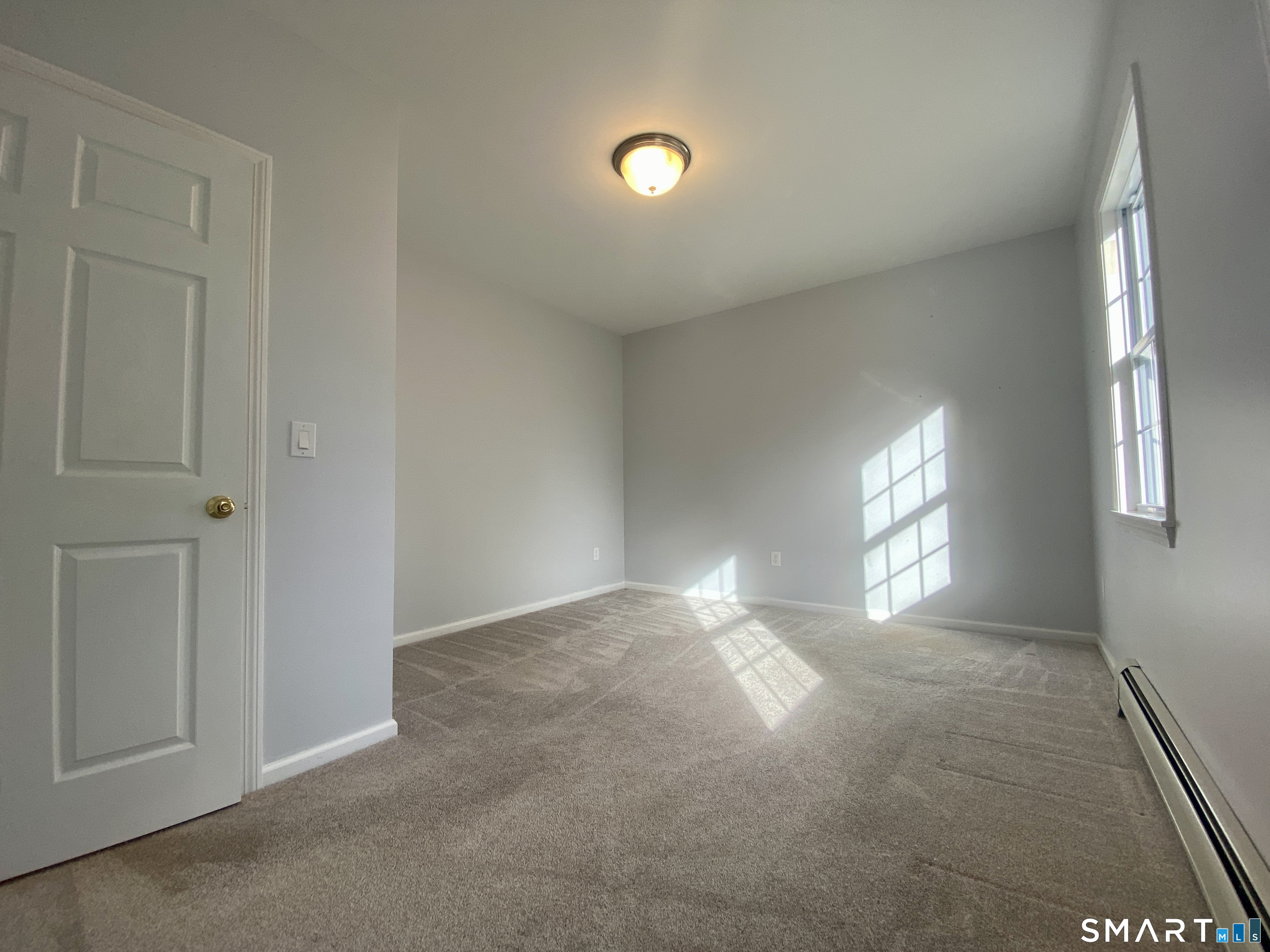 185 Whitbeck Road New Hartford, CT 06057 - Photo 13 of 18 a view of an empty room and window