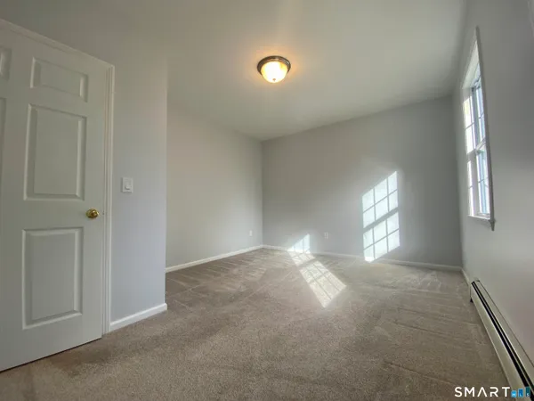a view of an empty room and window