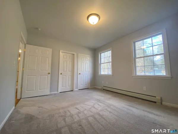 an empty room with windows