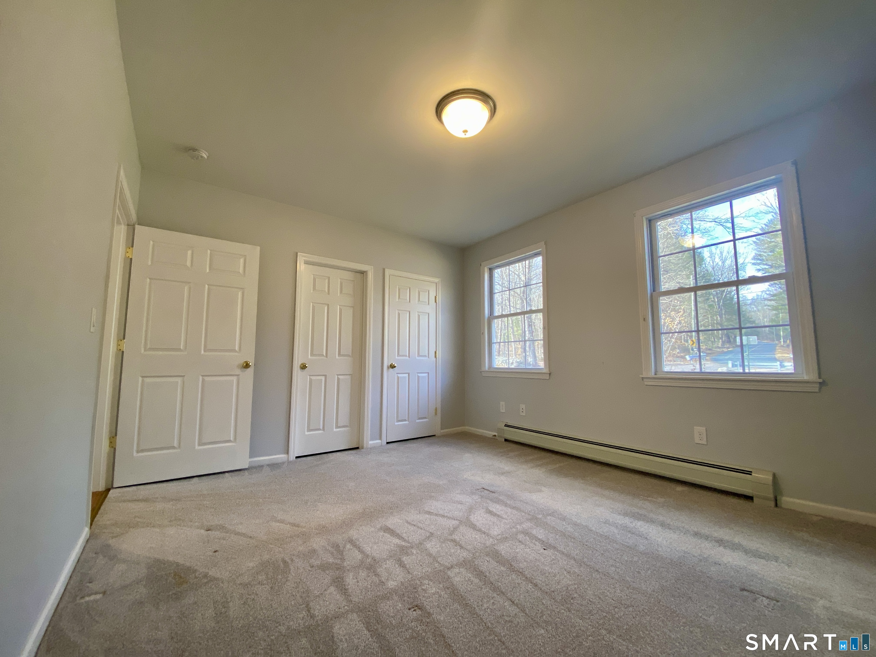 185 Whitbeck Road New Hartford, CT 06057 - Photo 18 of 18 an empty room with windows