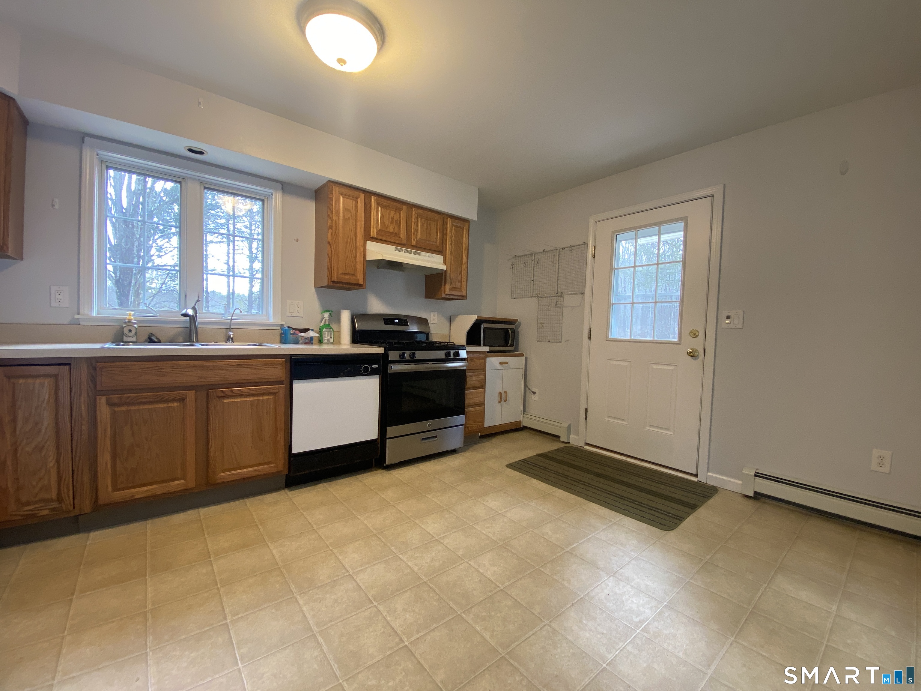 185 Whitbeck Road New Hartford, CT 06057 - Photo 4 of 18 a kitchen with stainless steel appliances granite countertop a stove sink and cabinets