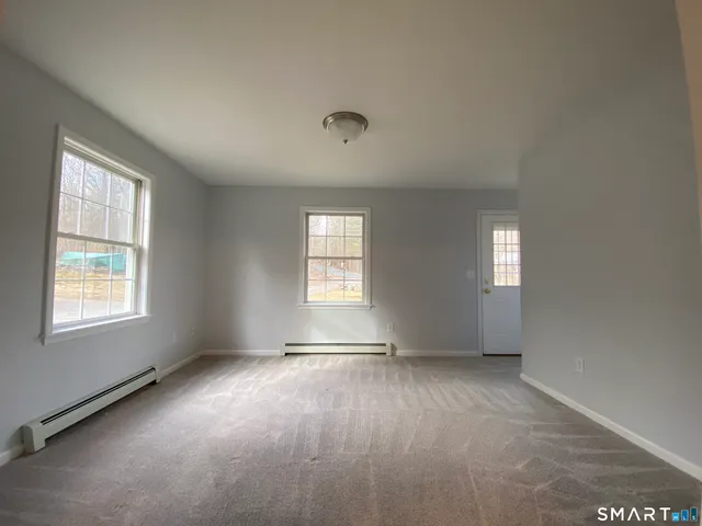 an empty room with windows