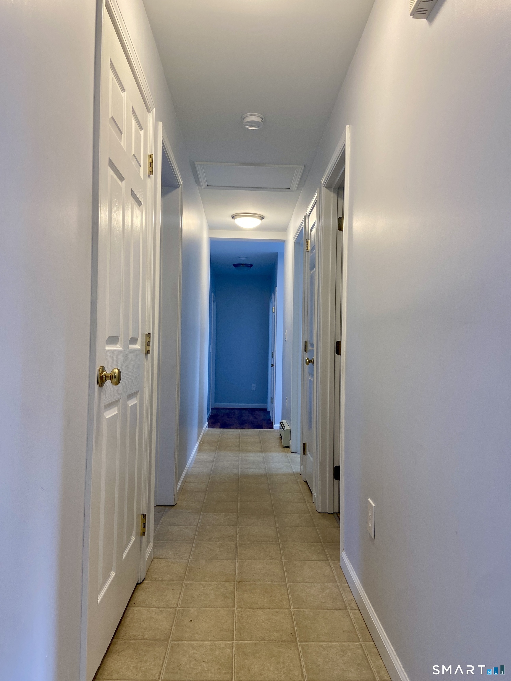 185 Whitbeck Road New Hartford, CT 06057 - Photo 6 of 18 a view of a hallway with wooden shelves