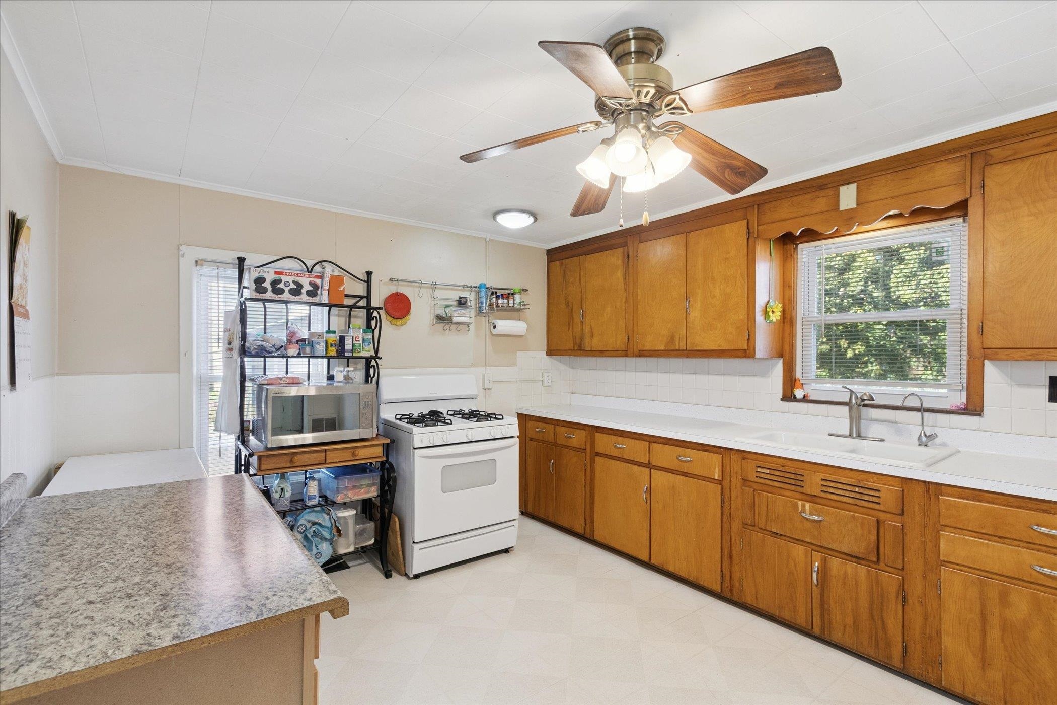 2683 West Florence Road Freeport, IL 61032 - Photo 11 of 36 a kitchen with stainless steel appliances granite countertop a sink and cabinets