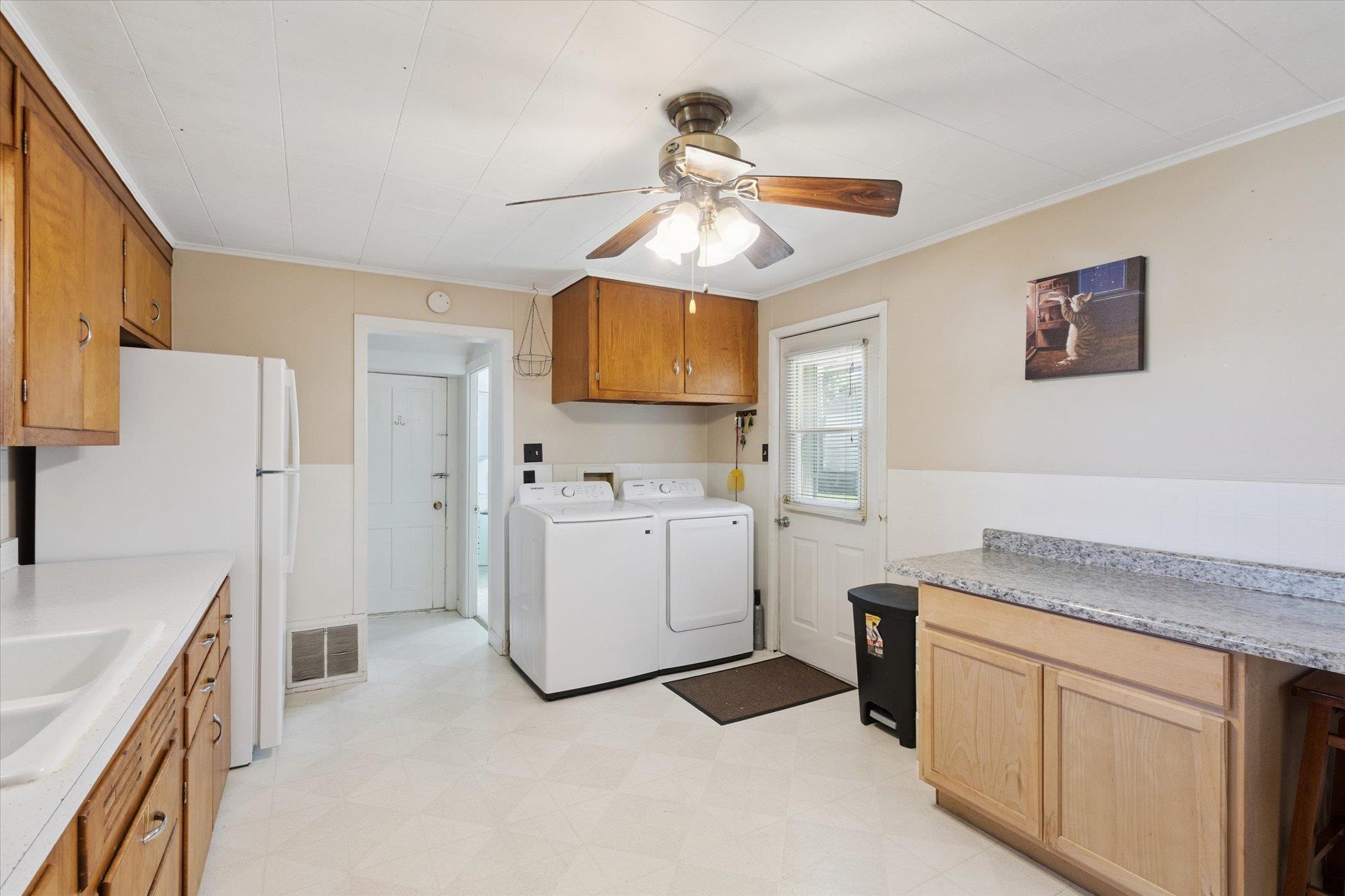 2683 West Florence Road Freeport, IL 61032 - Photo 13 of 36 a kitchen with a stove a sink and a refrigerator