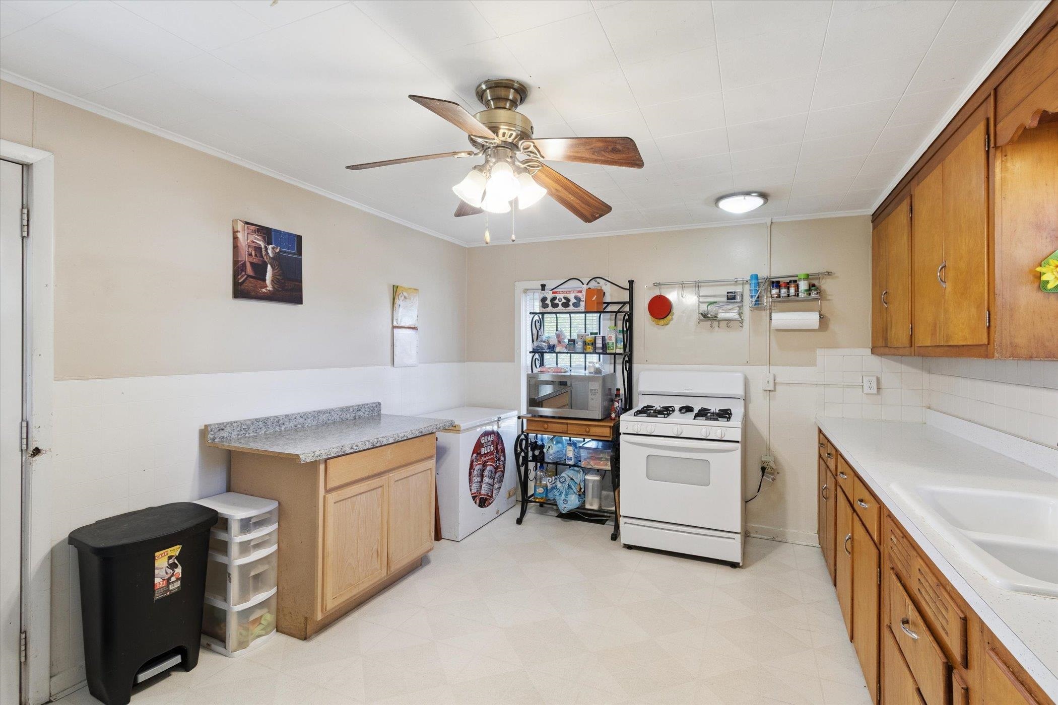 2683 West Florence Road Freeport, IL 61032 - Photo 14 of 36 a kitchen with a stove and a refrigerator
