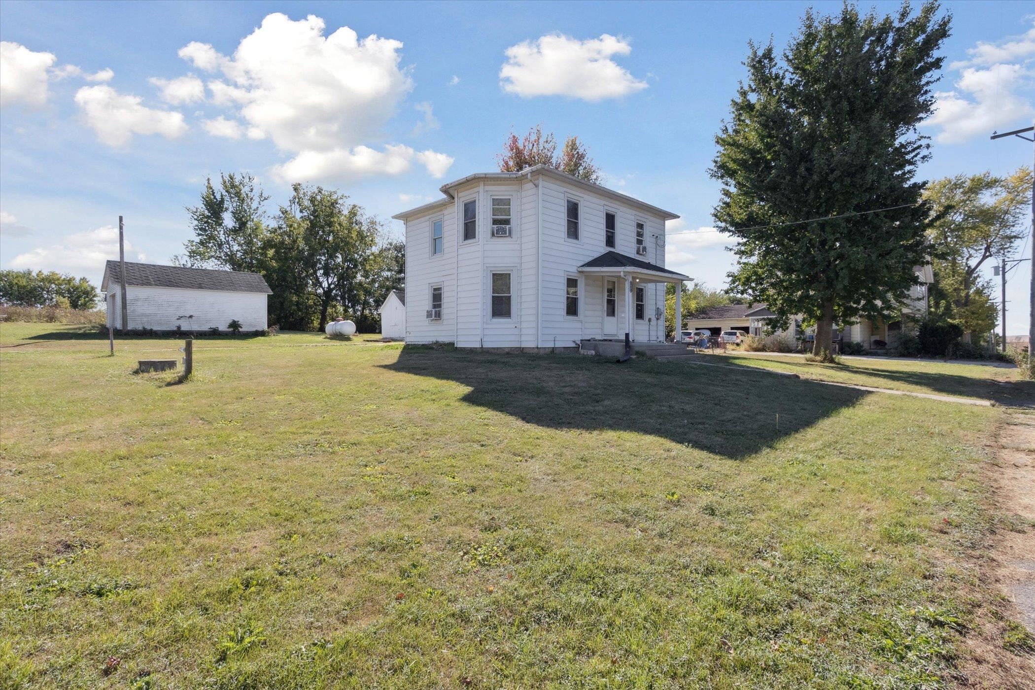 2683 West Florence Road Freeport, IL 61032 - Photo 2 of 36 a view of a white house with a yard