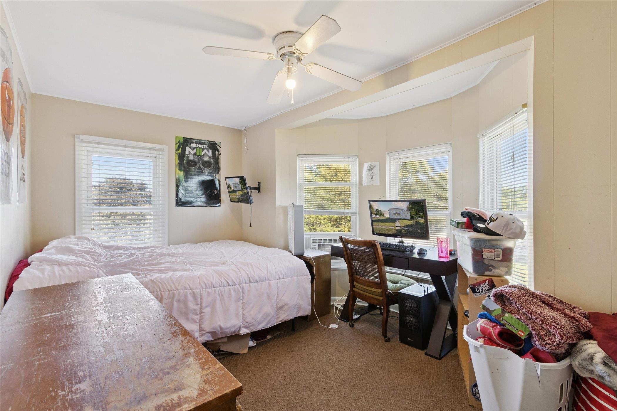 2683 West Florence Road Freeport, IL 61032 - Photo 24 of 36 a bedroom with a bed and a chandelier