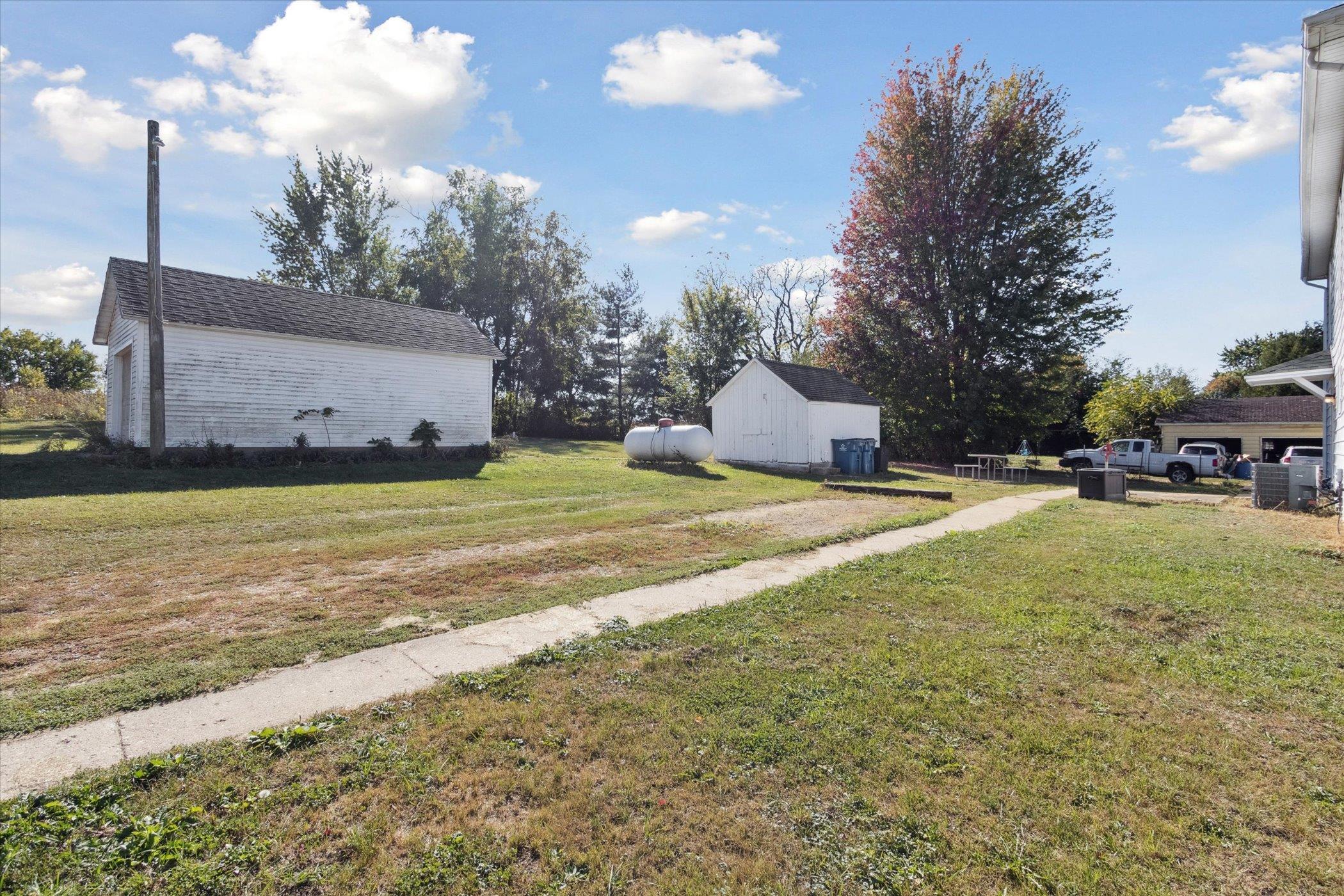 2683 West Florence Road Freeport, IL 61032 - Photo 35 of 36 a view of yard with swimming pool and trees