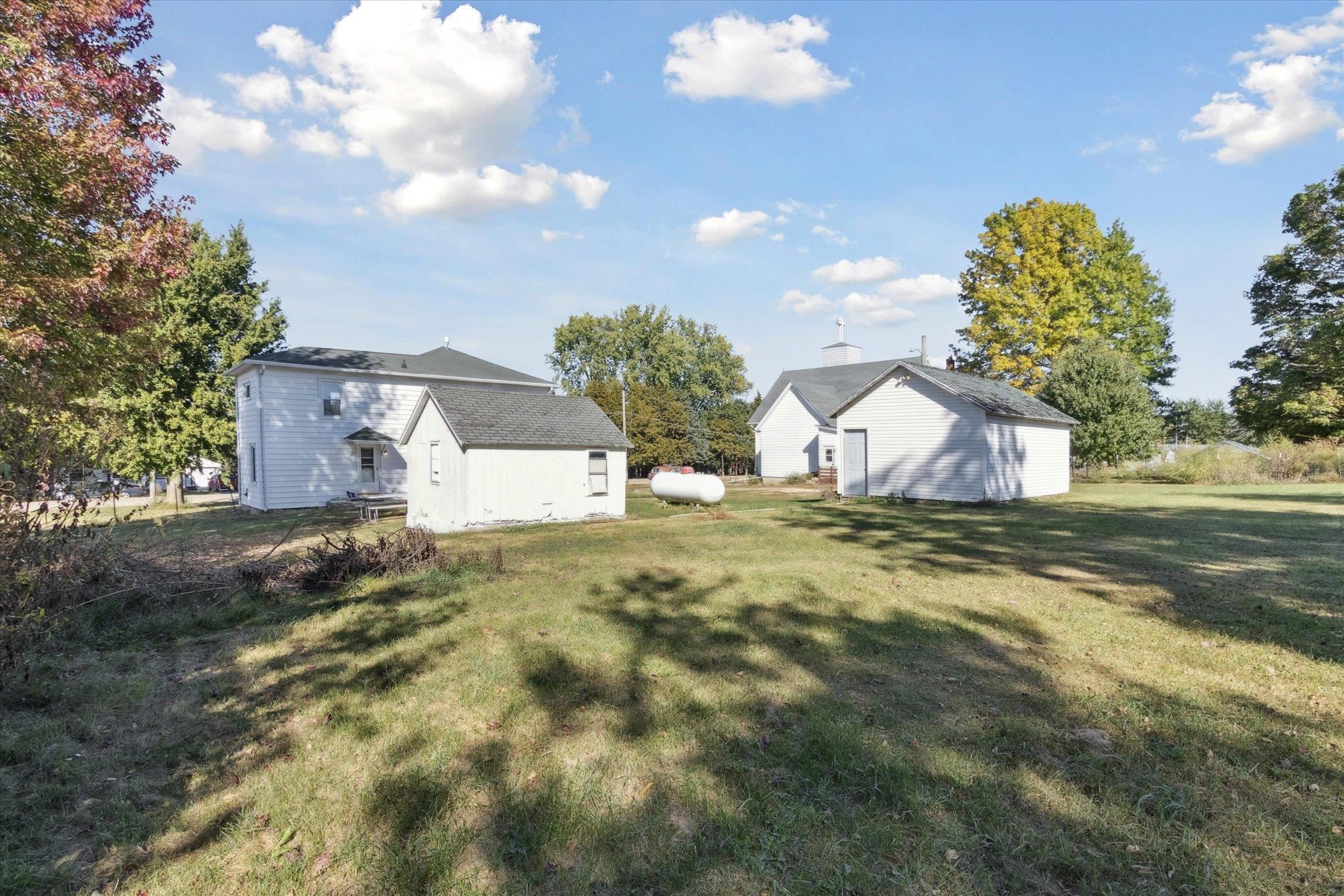 2683 West Florence Road Freeport, IL 61032 - Photo 36 of 36 a view of a house with a yard and a garage