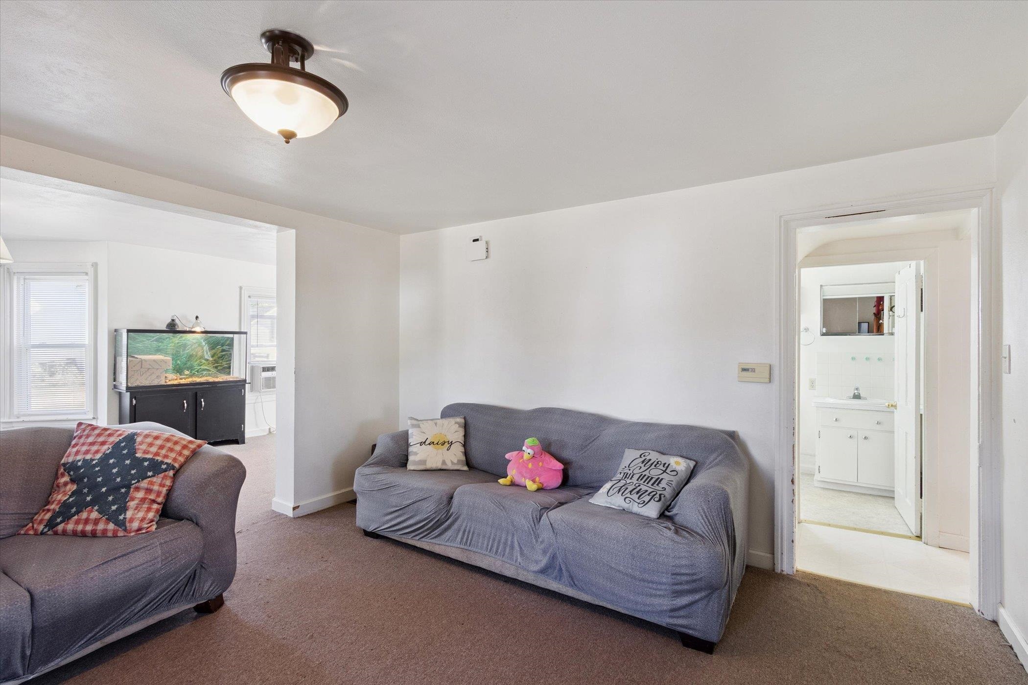 2683 West Florence Road Freeport, IL 61032 - Photo 9 of 36 a living room with furniture and a lamp