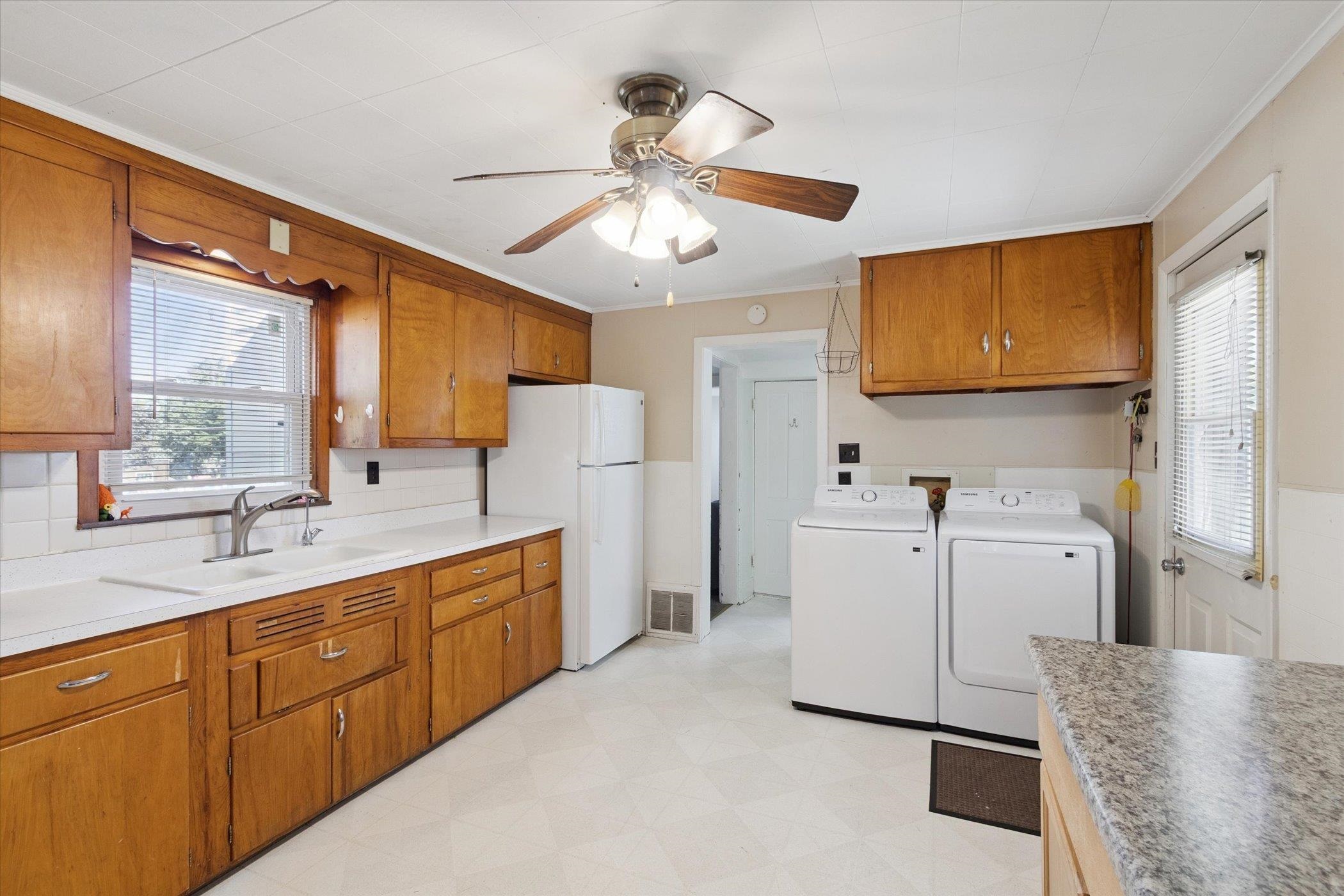 2683 West Florence Road Freeport, IL 61032 - Photo 10 of 36 a kitchen with sink cabinets and refrigerator