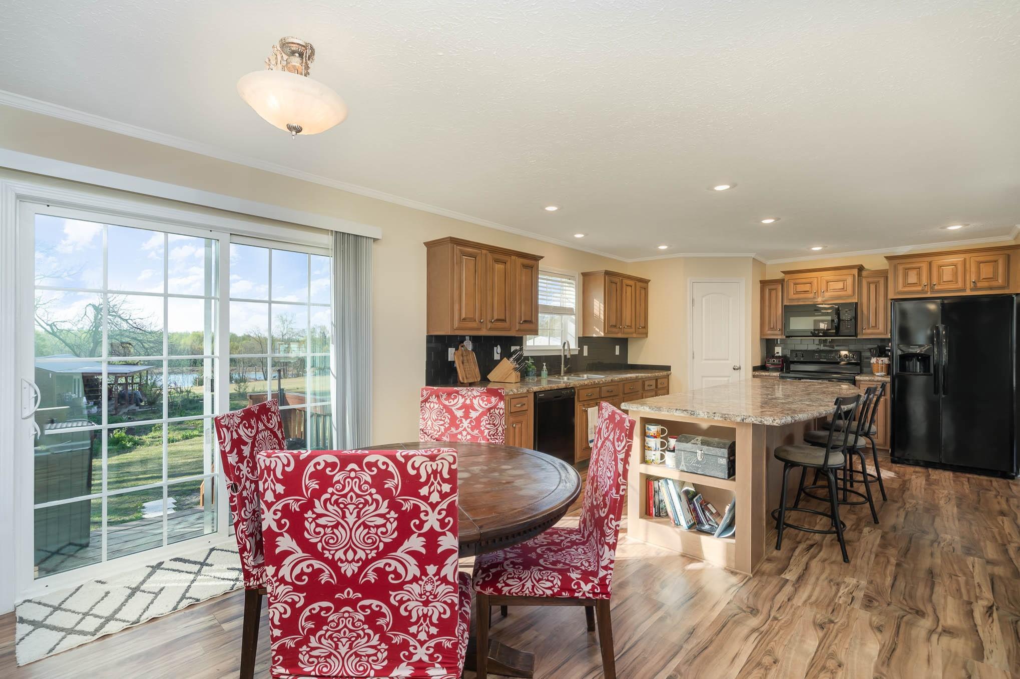 1811 Overbrook Road Kershaw, SC 29067 - Photo 14 of 32 a view of a dining room with furniture window and wooden floor