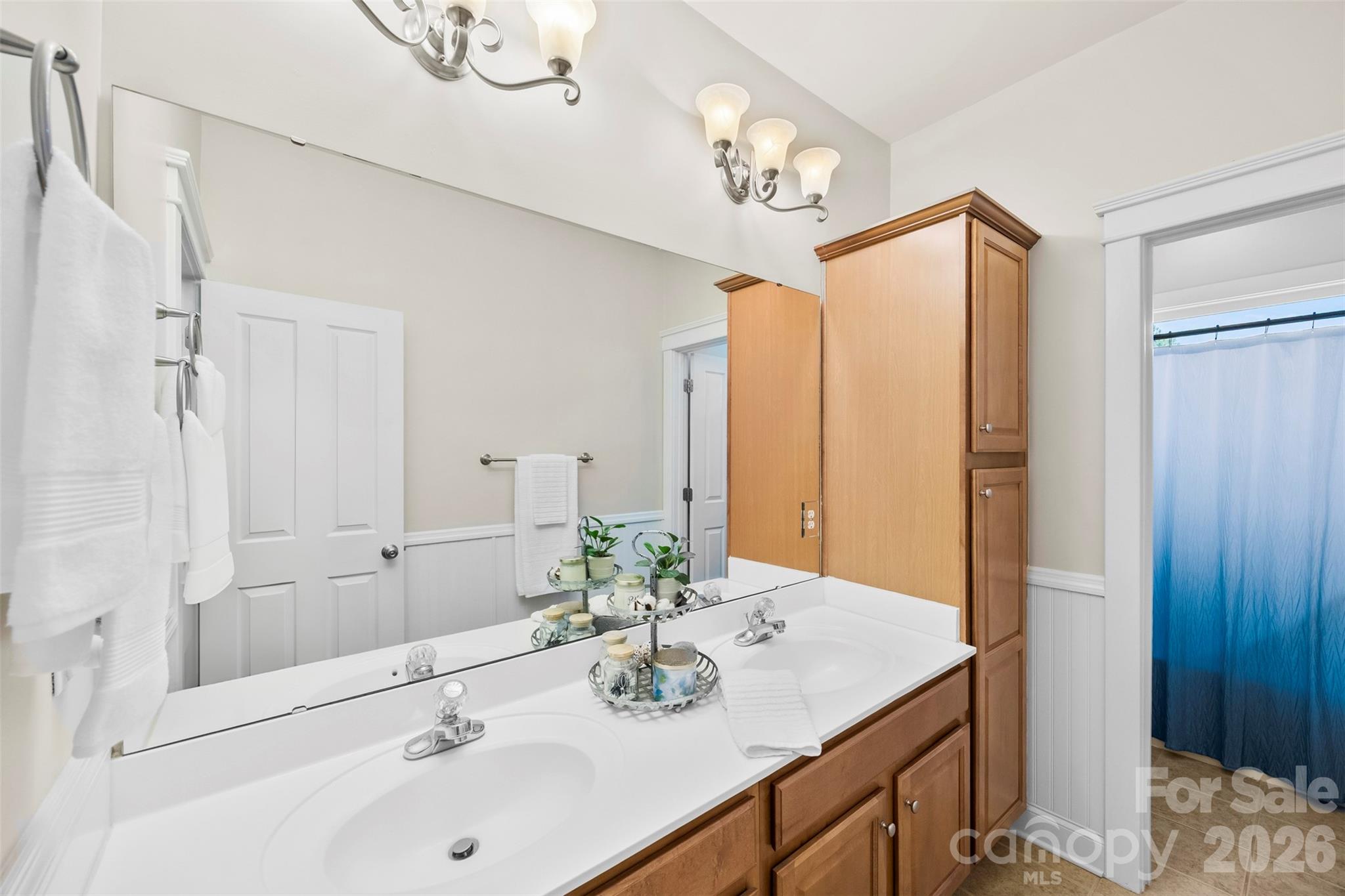 606 Andover Lane Tega Cay, SC 29708 - Photo 27 of 48 a bathroom with a sink vanity granite and a mirror