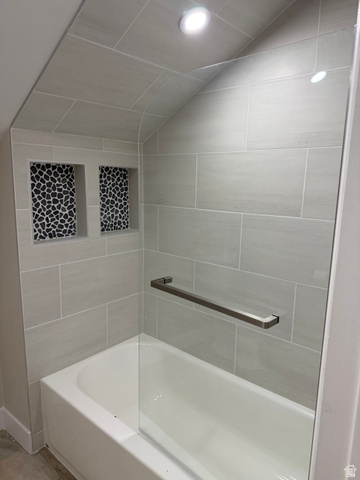 8965 Quail Run Drive Sandy, UT 84093 - Photo 51 of 56 Bathtub with light gray subway tile surround, two tiled shower niches with black and white pebble mosaic, clear glass shower panel, and recessed lighting
