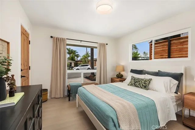 a bedroom with a bed and a desk