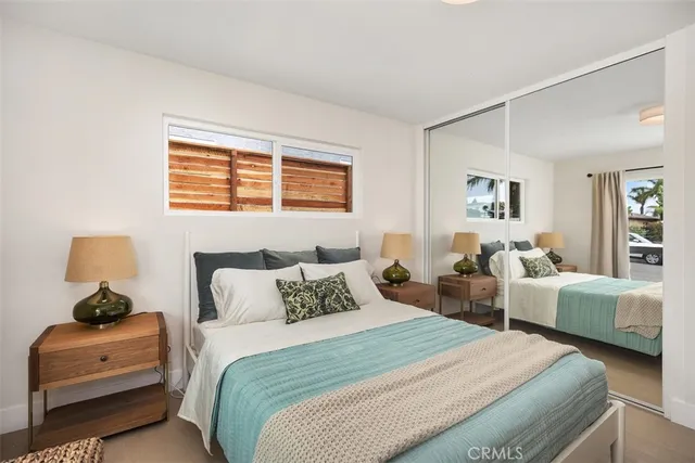 a bedroom with bed and a couch